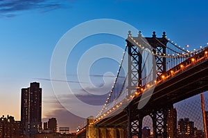 Manhattan Bridge and skyline silhouette view from Brooklyn at sunset