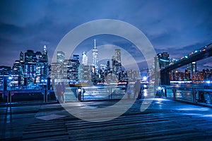 Manhattan and Brooklyn bridge night view and the people