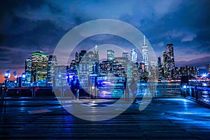 Manhattan and Brooklyn bridge night view and the people