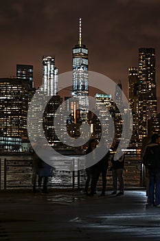 Manhattan and Brooklyn bridge night view and the people