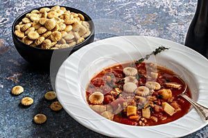 Manhattan Clam Chowder with Oyster crackers on a Flat Lay