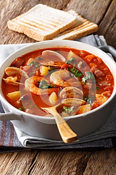 Manhattan chowder soup close-up. vertical