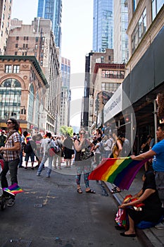 Manhattan, New York, June, 2017: people waiting for The Gay Pride Parade under the shade of buildings