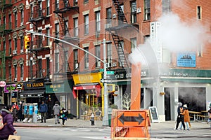 Manhattan, New York, USA - December 26, 2019: Typical vew of street in East Village with local people, apartment bulidings, shops