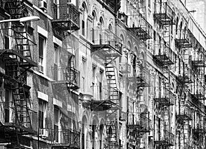 Manhattan old residential buildings with fire escapes, New York City, USA