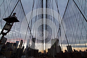 Manhattan panorama view through brooklyn bridge cables