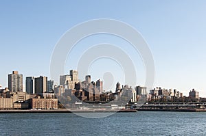 Manhattan skyline from bay on sunny day with copyspace