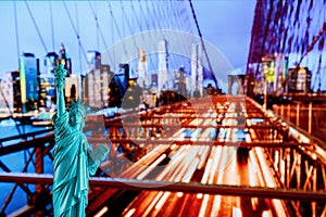 Manhattan Skyline, Brooklyn Bridge and The Statue of Liberty at Night Lights, New York City