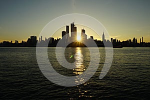 Manhattan skyline hiding the sunrise