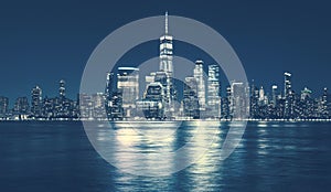 Manhattan skyline at night, blue color toned, New York City, USA