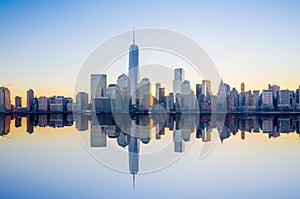 Manhattan Skyline with the One World Trade Center building at twilight photo