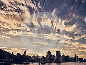 Manhattan skyline silhouette at sunset, New York