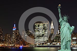 Manhattan Skyline and The Statue of Liberty at Night