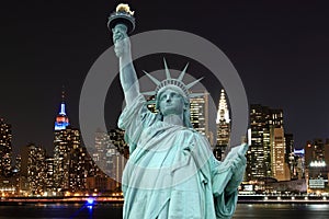 Manhattan Skyline and The Statue of Liberty at Night