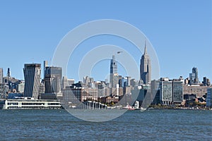 Manhattan skyscrapers view from the water, modern architecture of New York City landscape from the waterfront