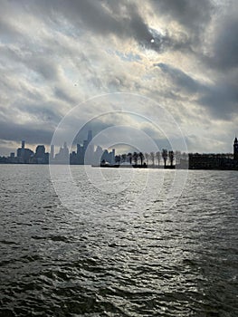 Manhattan skyscrapers view from the water, modern architecture of New York City landscape from the waterfront