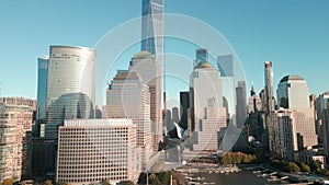 Manhattan view from above. Forwards fly above street between modern buildings. Day in Manhattan, NYC aerial view. New