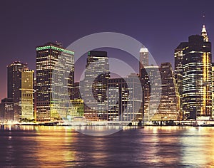 Manhattan waterfront skyline at night, color toning applied, New York City, USA