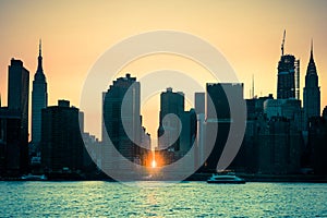 Manhattanhenge New York City skyline seen at sunset with sunlight