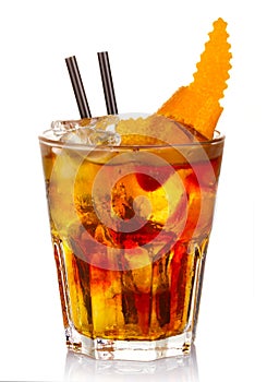 Manhatten alcohol cocktail with orange fruit slices isolated