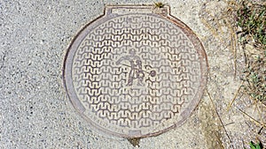 Manhole cover with salt worker illustration. Saltworks `soline` in SeÄovlje - Sicciole  Portoroz  Slovenia  June 2020