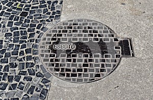 Manhole cover of sewerage on sidewalk, Petropolis, Brazil