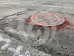 Manhole, Raised Manhole Outlined in Orange, Red