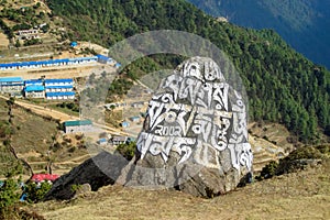 Mani colour Stones with Buddhist mantra Om mani padme hum in Himalaya Nepal