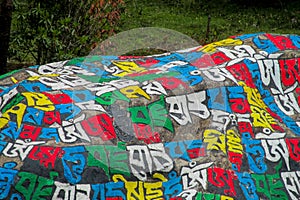 Mani colour Stones with Buddhist mantra Om mani padme hum in Himalaya Nepal