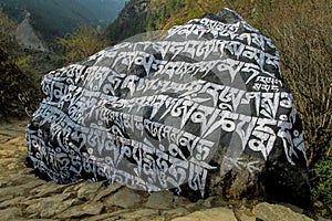 Mani colour Stones with Buddhist mantra Om mani padme hum in Himalaya Nepal