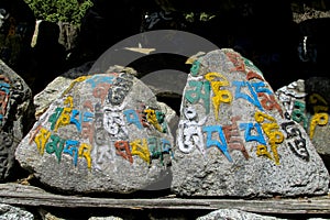 Mani colour Stones with Buddhist mantra Om mani padme hum in Himalaya Nepal