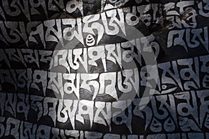 Mani stone with buddhist mantra Om Mani Padme Hum in Nepal Himalaya