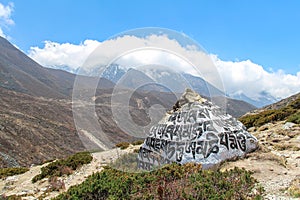 Mani stone with buddhist mantras in Himalayas photo
