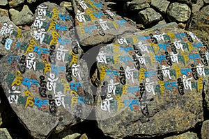 Mani Stones with Buddhist mantra Om mani padme hum in Himalaya, Nepal