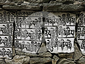Mani wall, buddhist mantra carved in stones, Nepal