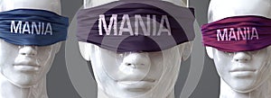Mania can blind our views and limit perspective - pictured as word Mania on eyes to symbolize that Mania can distort perception of