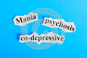 Mania co-depressive psychosis text on paper. Word Mania co-depressive psychosis on a piece of paper. Concept Image. Mania co-depre