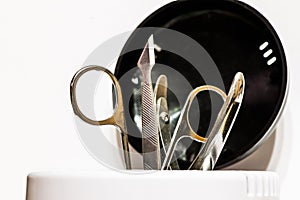 Manicure accessories in sterilizer isolated