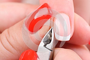 Manicure applying - cutting the cuticle