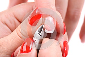 Manicure applying - cutting the cuticle