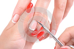 Manicure applying - cutting the cuticle photo