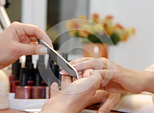 A manicure is in a beauty salon photo