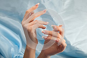 Manicure - Beauty treatment photo of nice manicured woman fingernails.