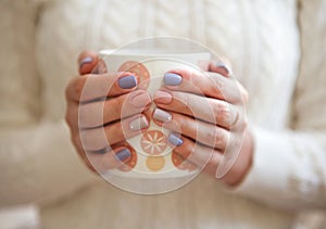 Manicure - Beauty treatment photo of nice manicured woman fingernails. Very nice feminine nail art with nice pink and purple nail