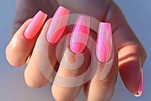 Manicure closeup. Woman pink nails close-up. Nail care in beauty salon. Spa healthy treatments for female hands. Fashion bright