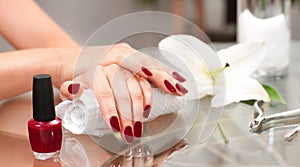 Manicure concept. Beautiful woman& x27;s hands with perfect manicure at beauty salon.