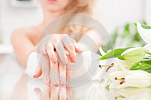 Manicure concept. Beautiful woman& x27;s hands with perfect manicure at beauty salon.