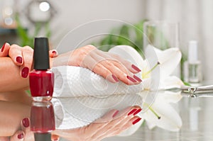 Manicure concept. Beautiful woman& x27;s hands with perfect manicure at beauty salon.