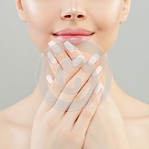 Manicure concept. Woman hands with white nails closeup