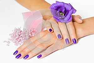 Manicure, flower, candle and beads